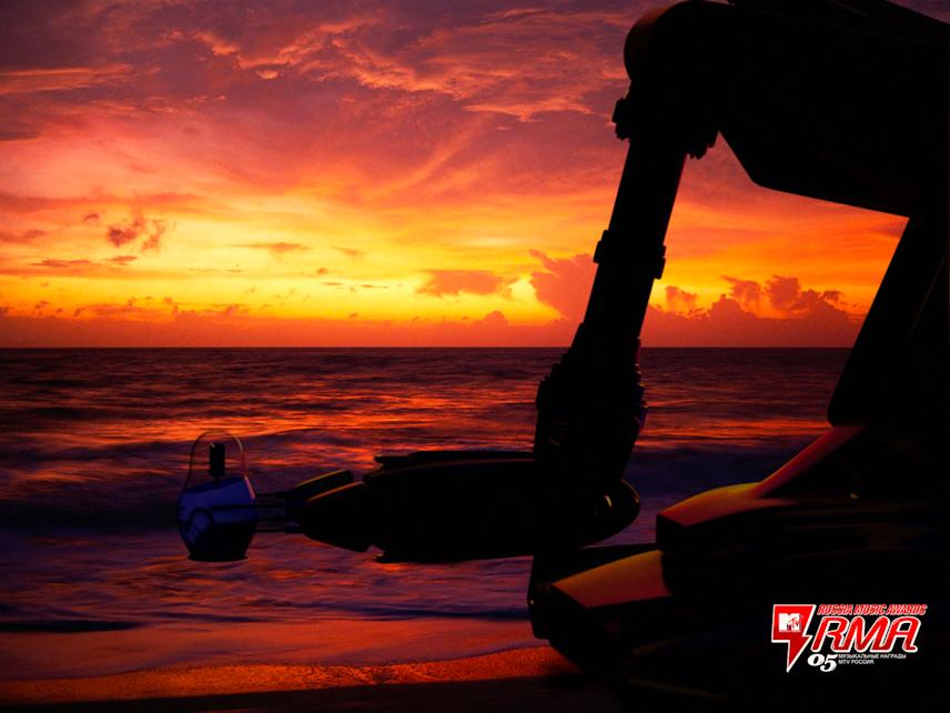 promotional visual for mtv rma.05 showing a futuristic robotic arm silhouette against a vivid sunset over the ocean, blending sci-fi aesthetics with atmospheric natural scenery