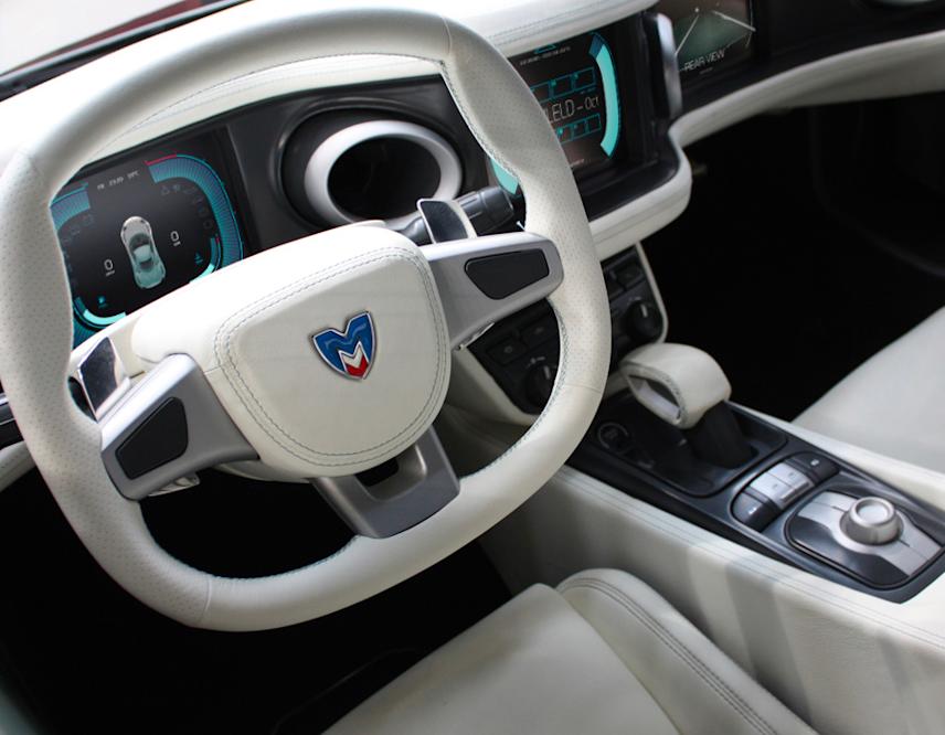 photograph of the marussia sports car interior featuring a dashboard interface