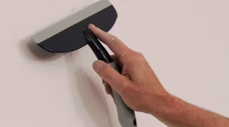 Hoe kan ik een muur glad maken?