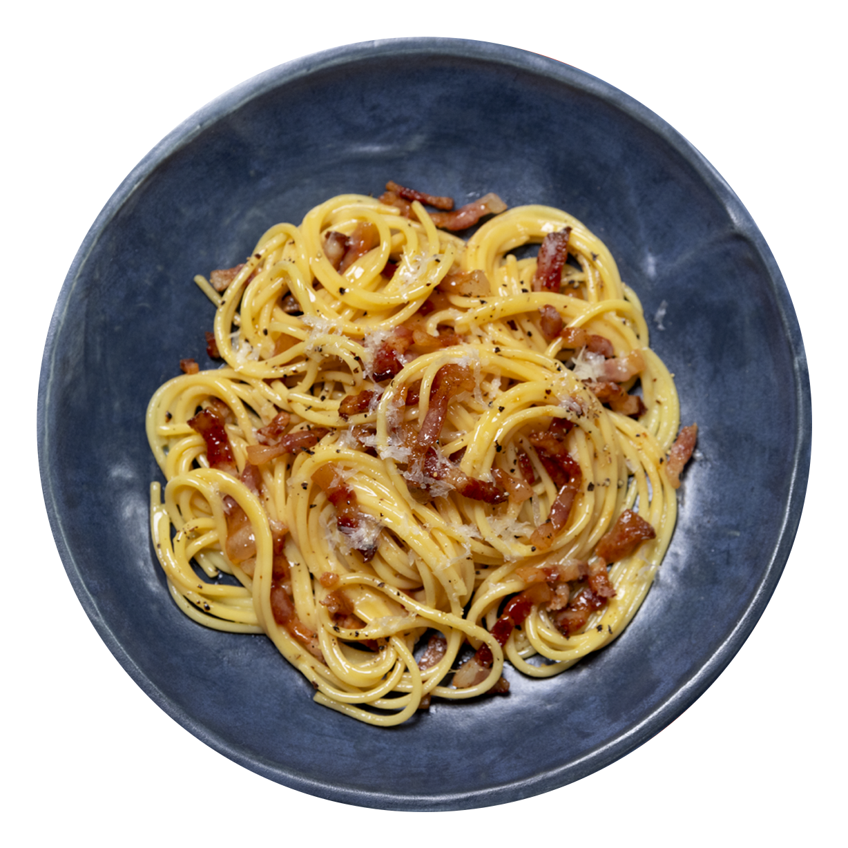 Carbonara sprinkled with cheese and pepper in a rustic blue bowl.