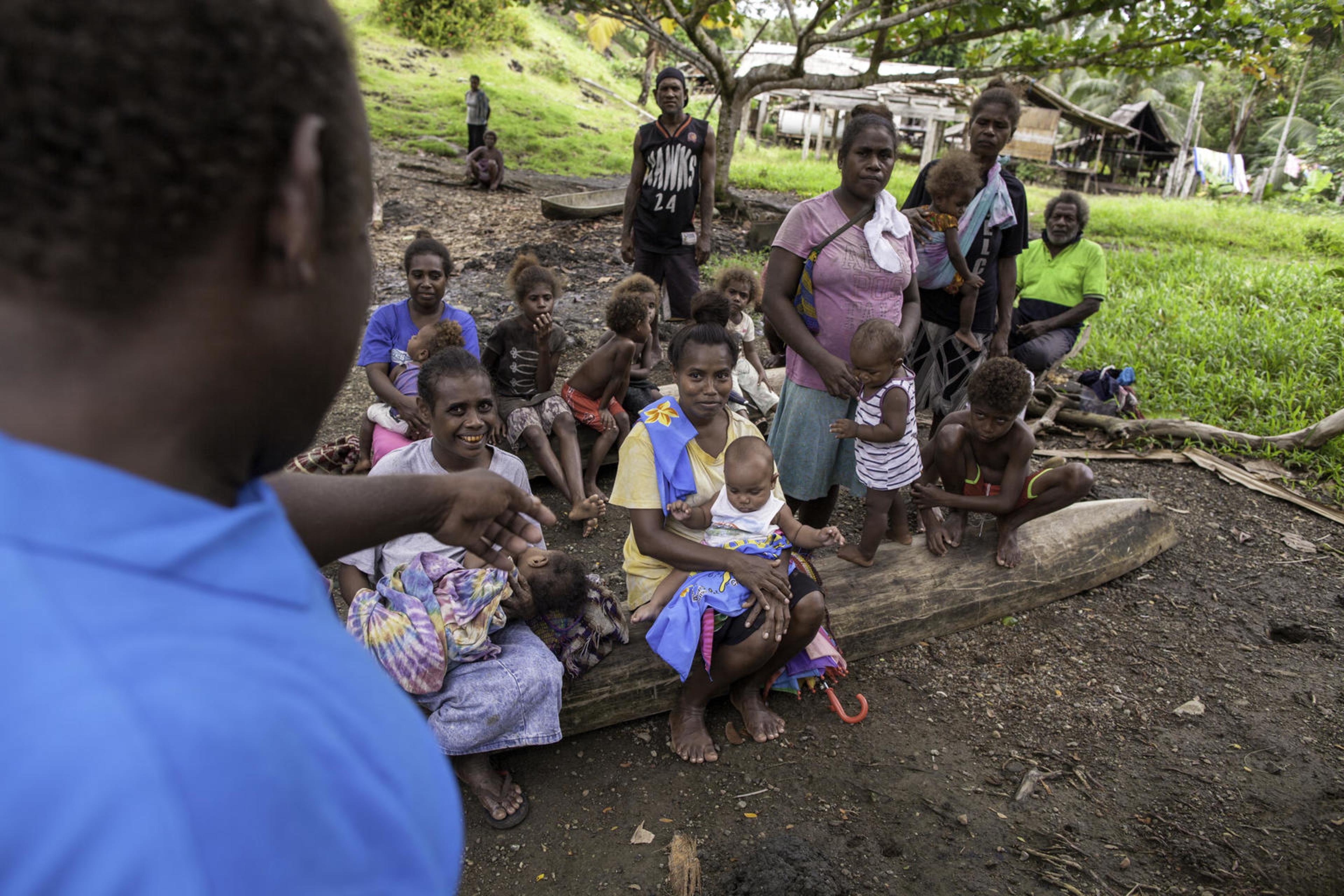 UNICEF Health Worker Paul Maesiala gives nutrition advice to a community in the Solomon Islands