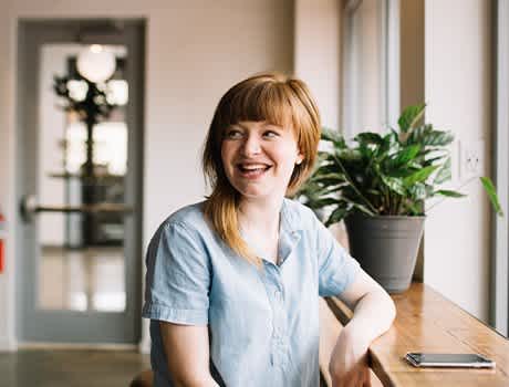 An image of a woman smiling. 