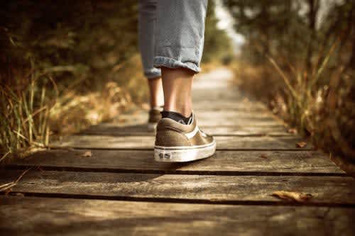 Image of feet walking down a path