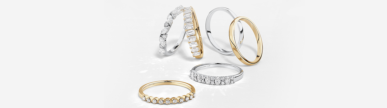 wedding bands flatlays yellow gold and white gold with diamonds