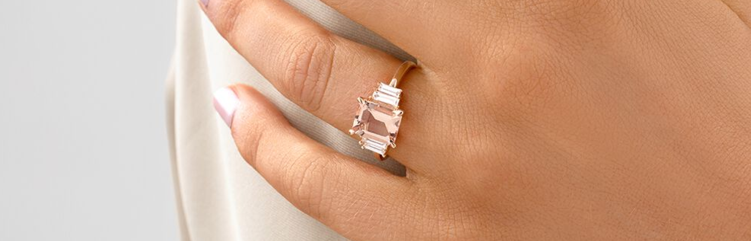 pink coloured gemstone engagement ring in rose gold