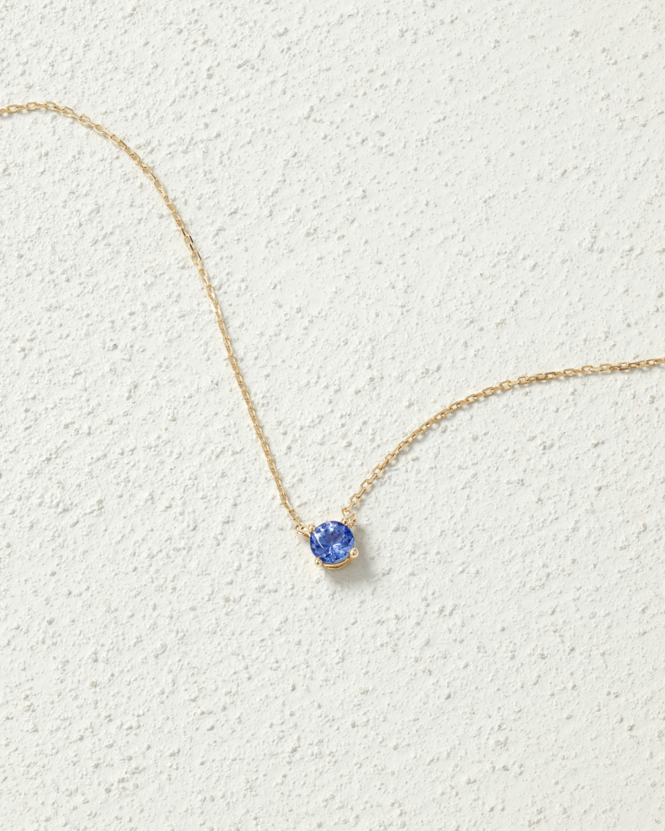 Flat lay of a tanzanite pendant 