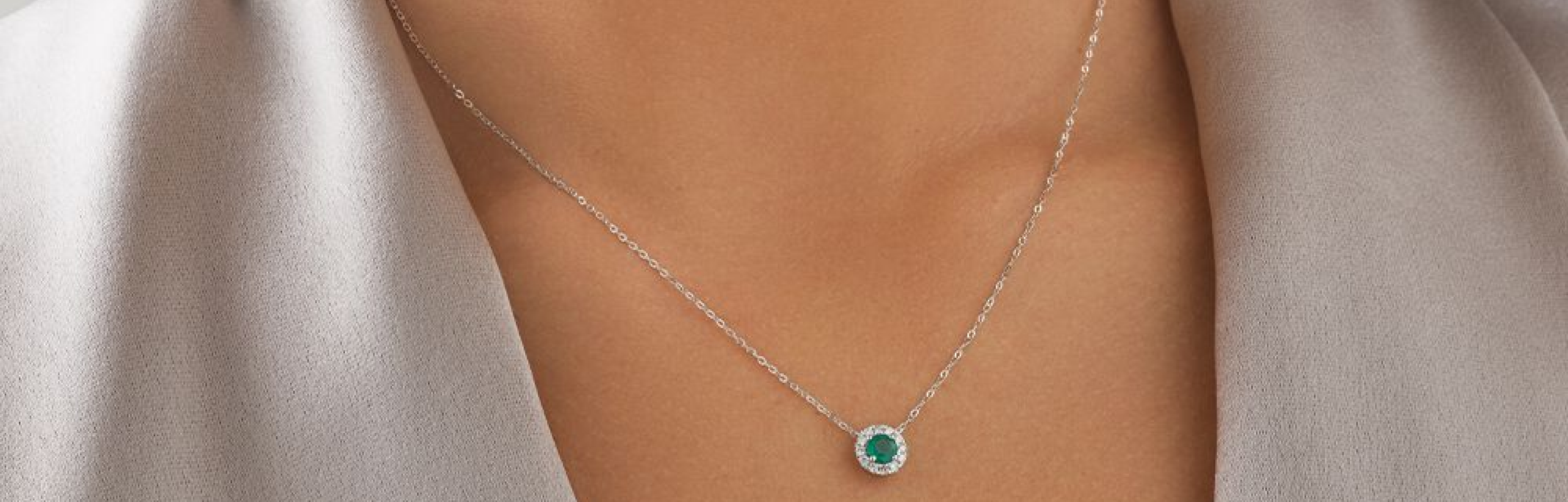 green stone pendant necklace in white gold