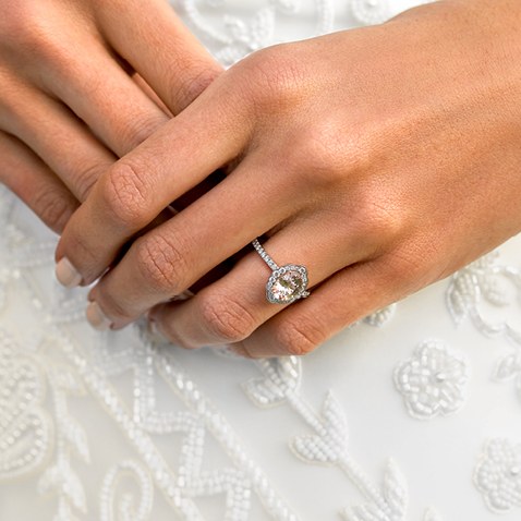 Bride holding hands with pink diamond engagement ring