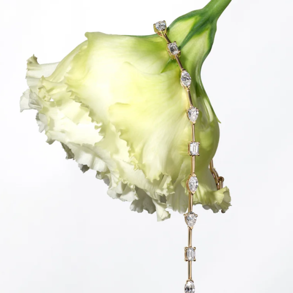 diamond tennis bracelet hanging off flower