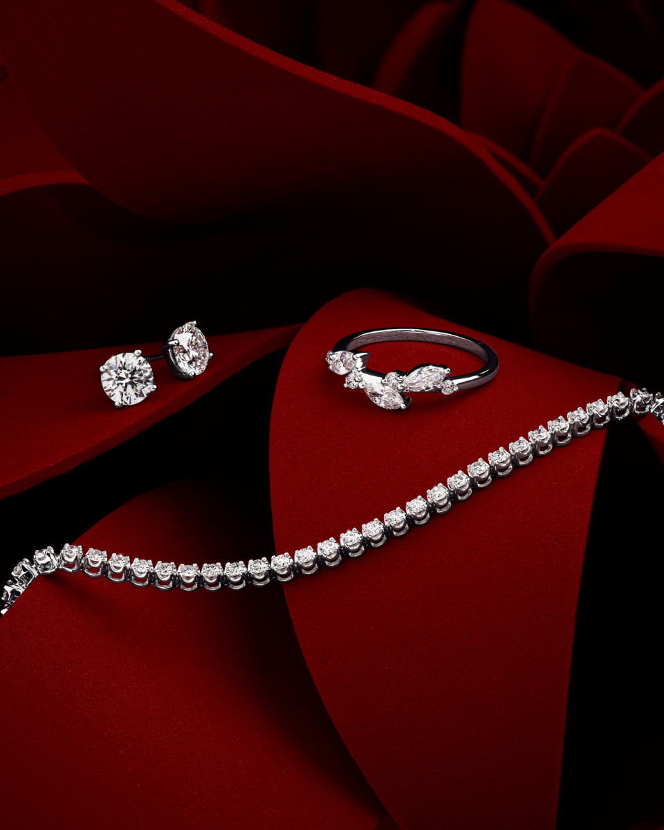 Flay lay of LAB diamond studs, ring and tennis bracelet 