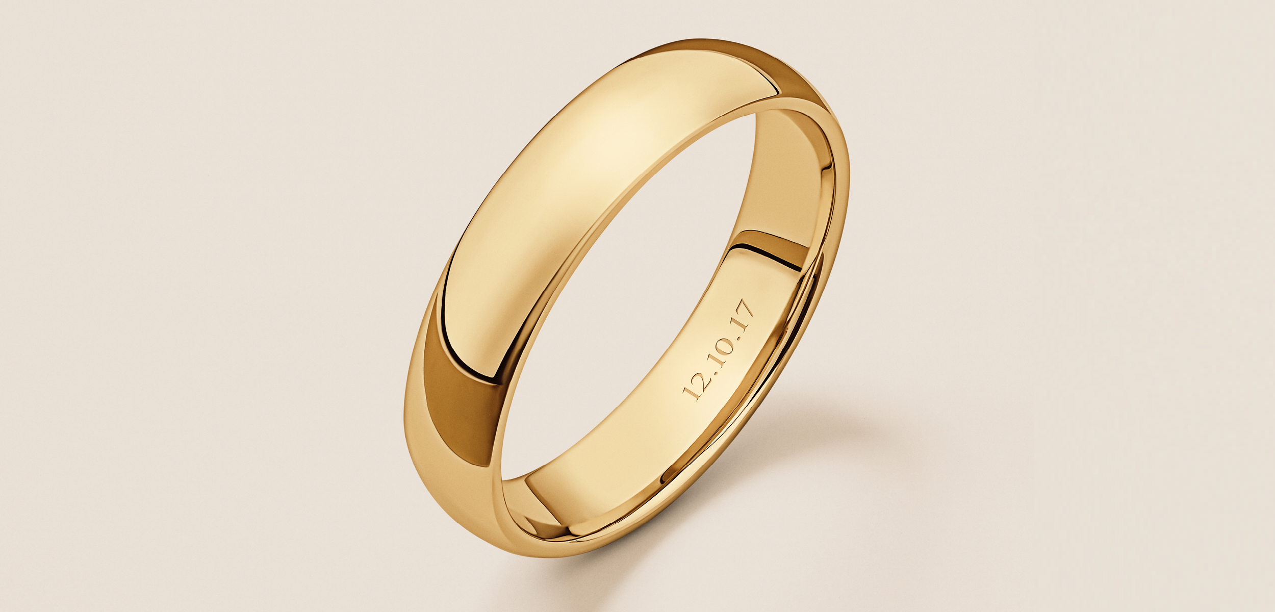 Yellow Gold wedding band engraved with a significant date