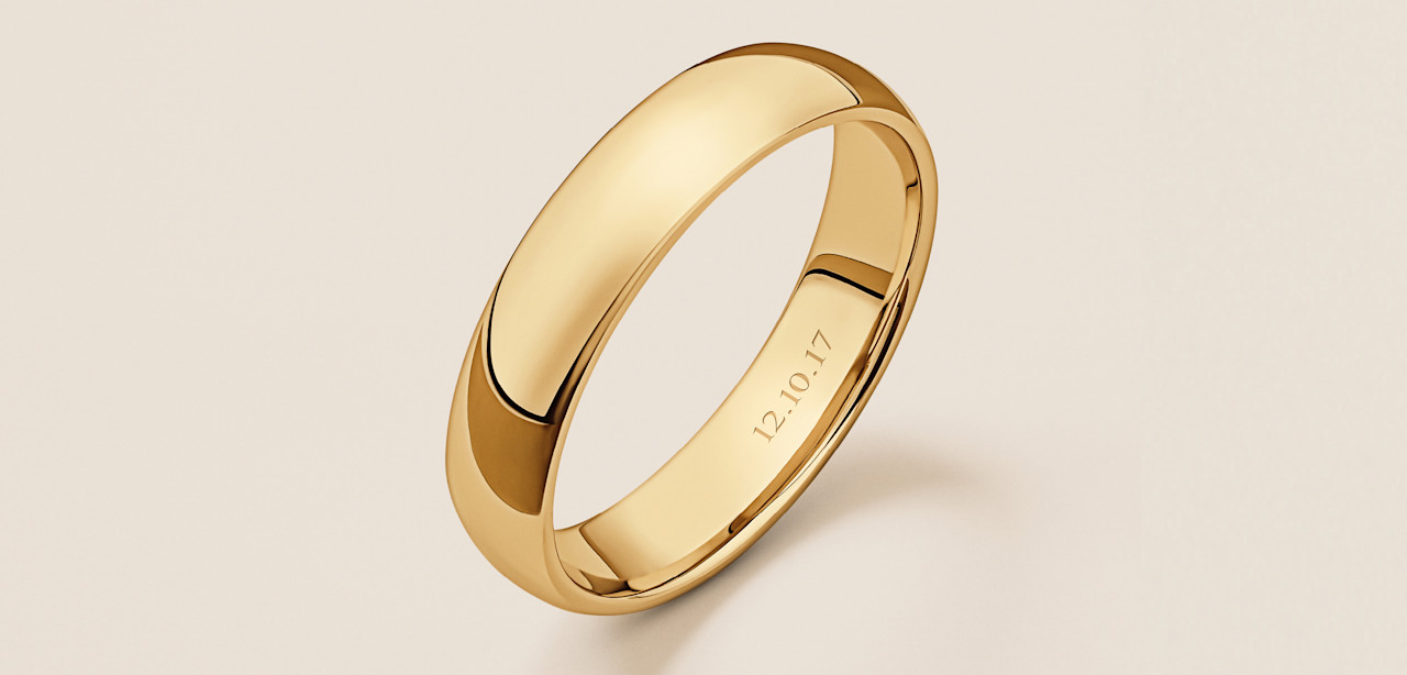 Yellow Gold wedding band engraved with a significant date