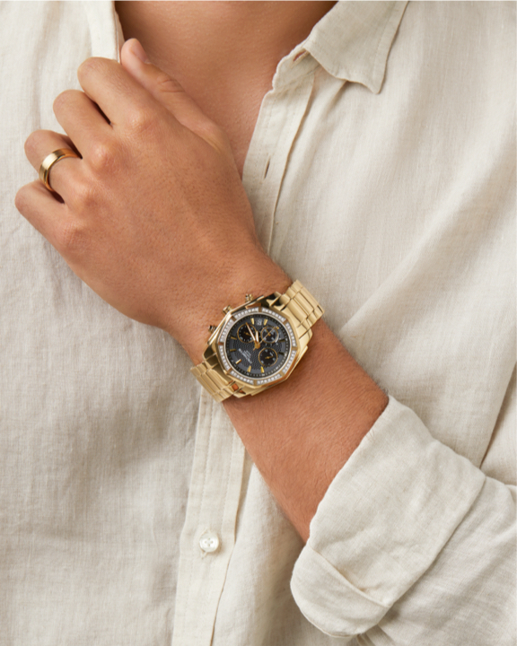 man wearing silver watch with black watch face