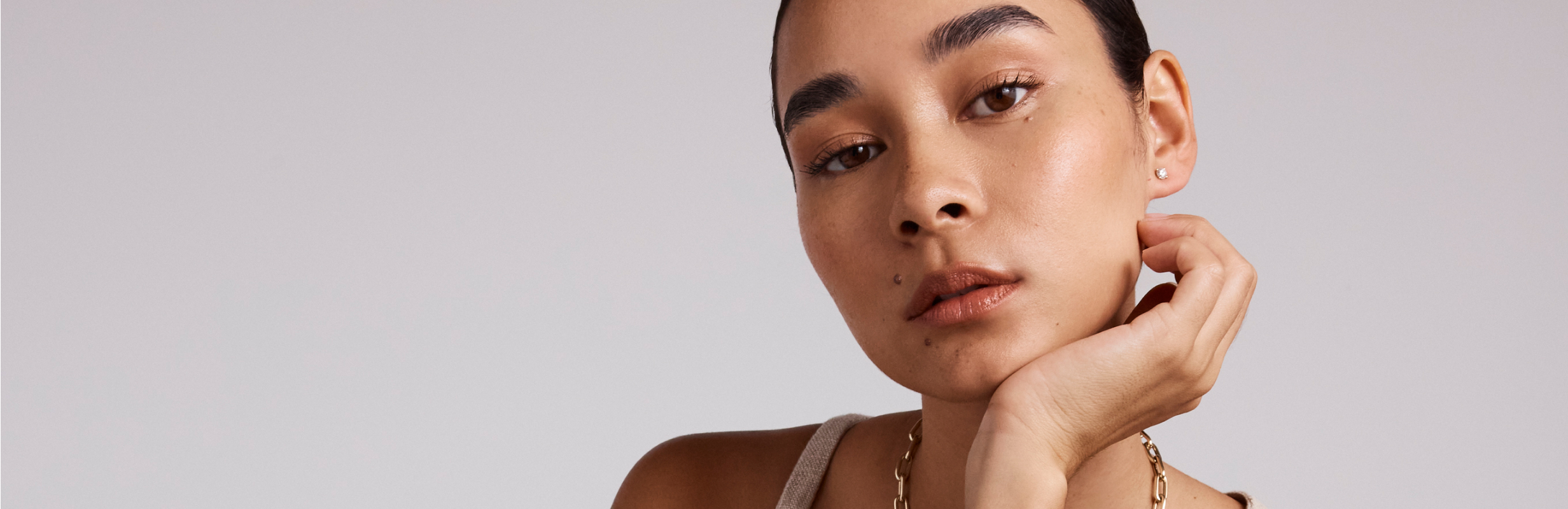 model wearing tennis bracelet and gold bangle