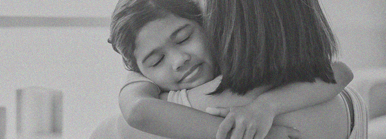 Girl hugging her mum 