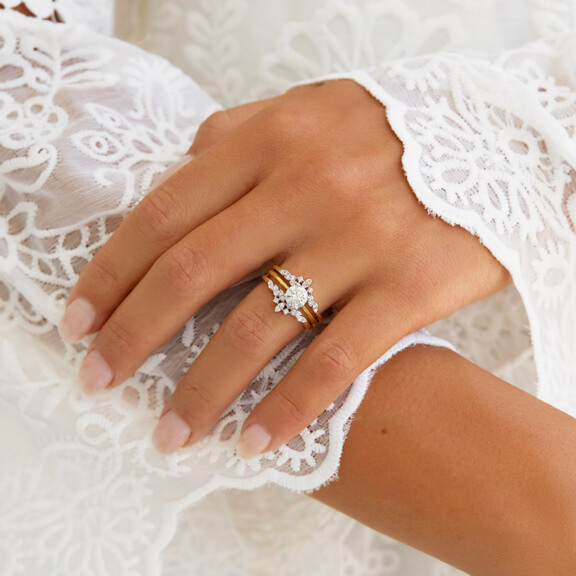 solitare diamond ring and ring enhancer on left hand ring finger