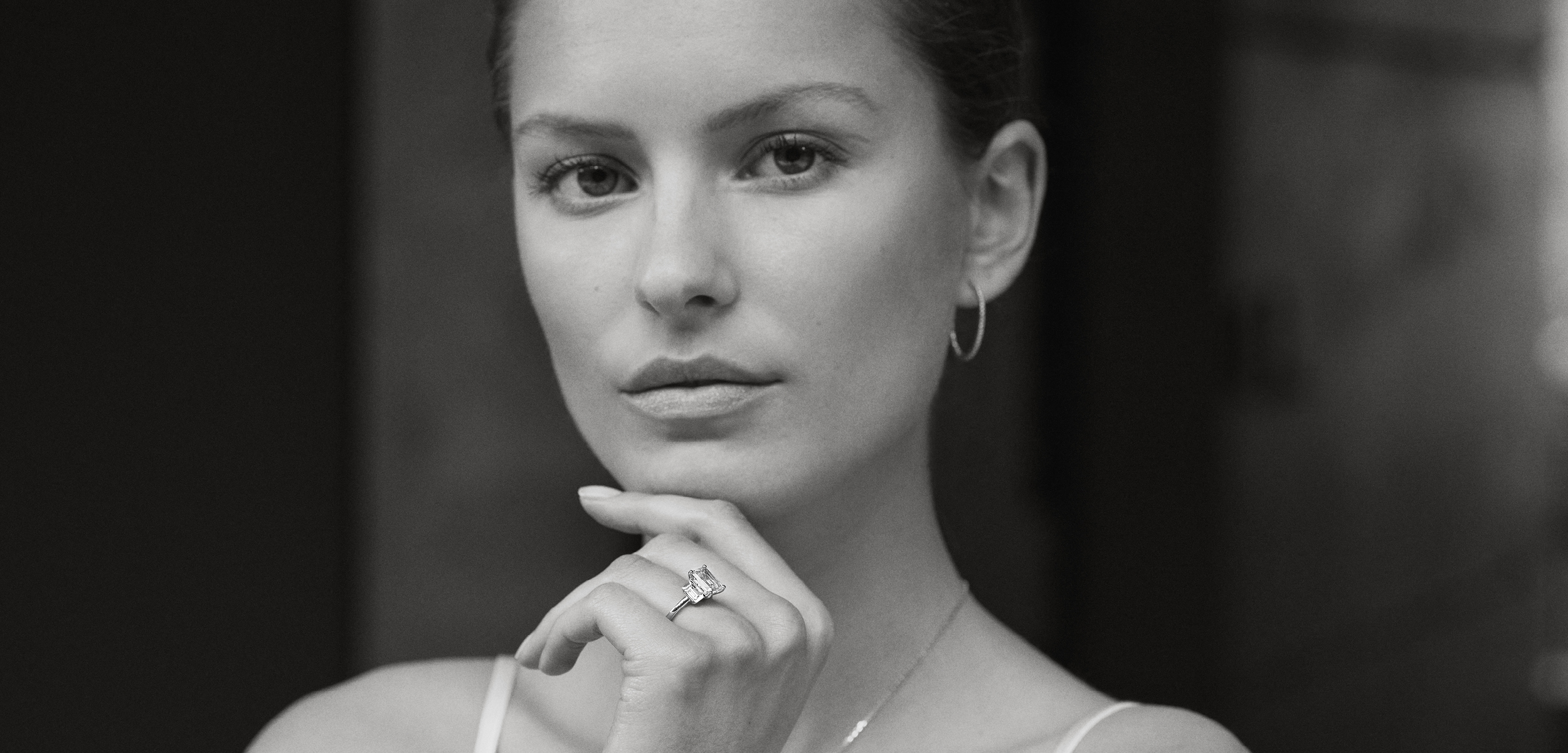 Close up of bride wearing engagement ring