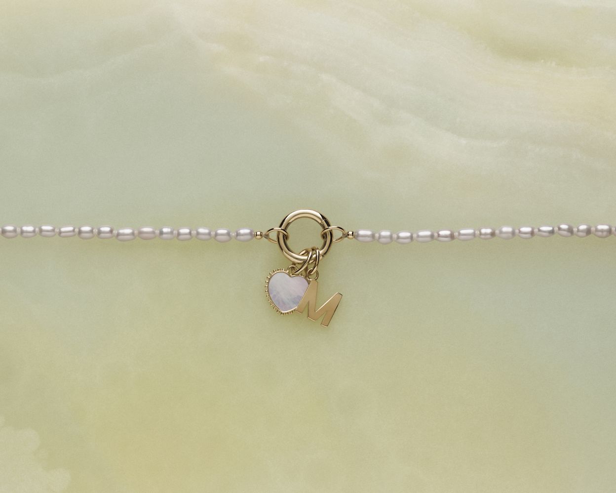 Flat lay of pearl open chain necklace with pendants 