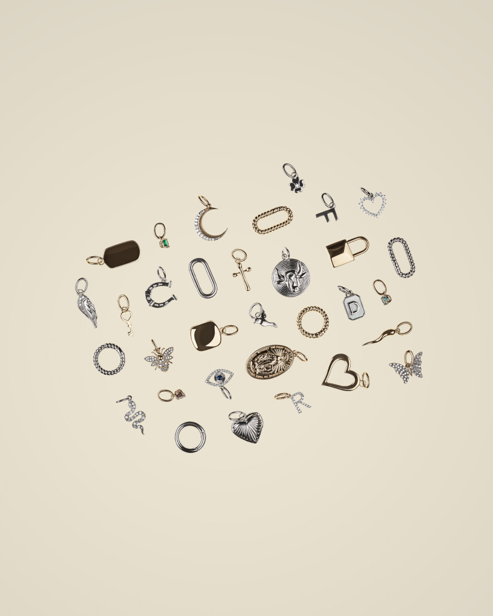 Flatlay of mixed metal pendants 