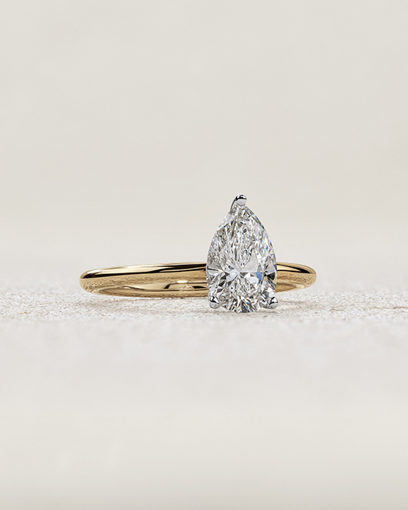 pear cut diamond solitaire engagement ring in yellow gold