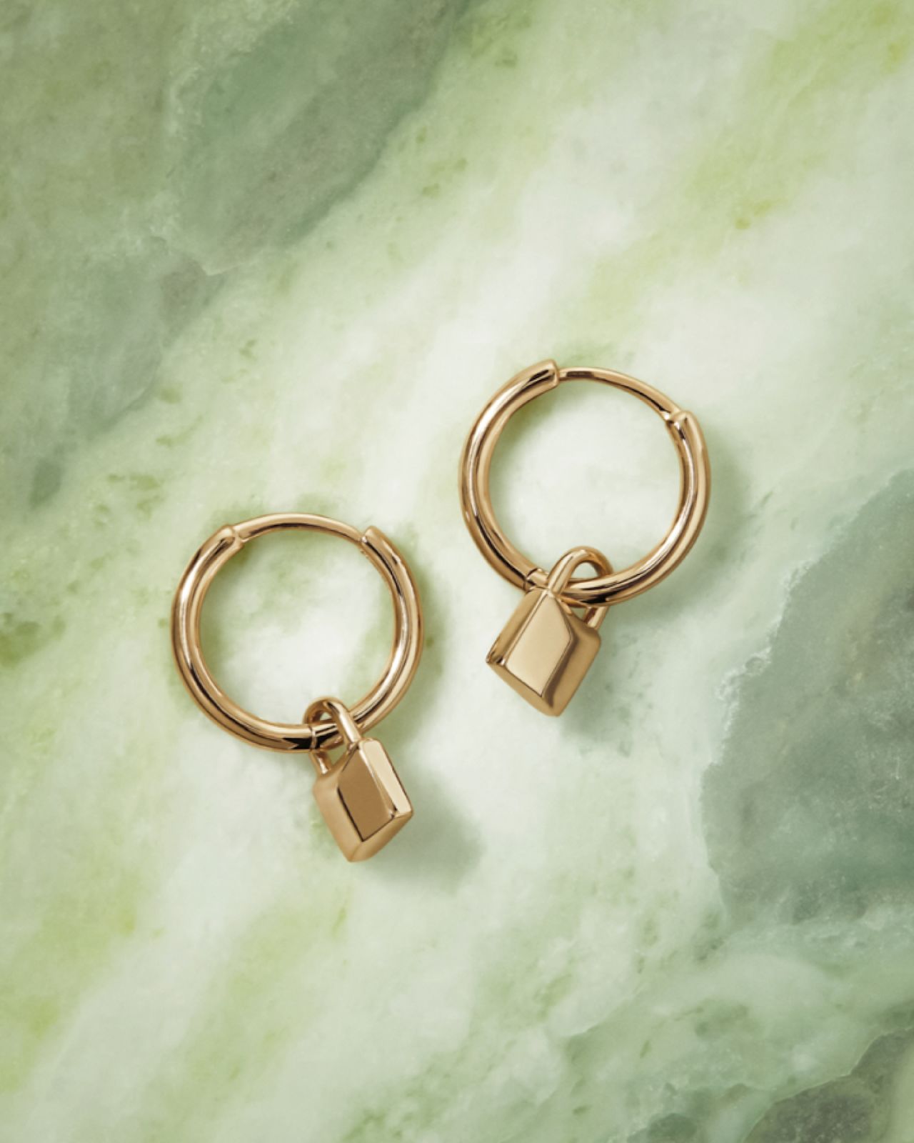 sig lock earrings