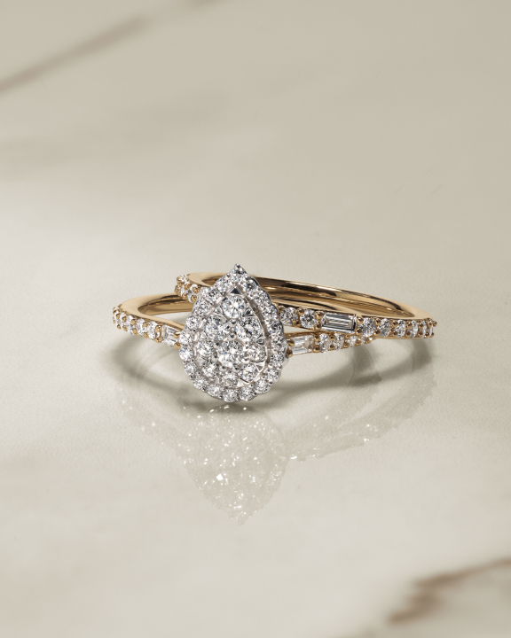 dainty pear cluster engagement ring with wedding band