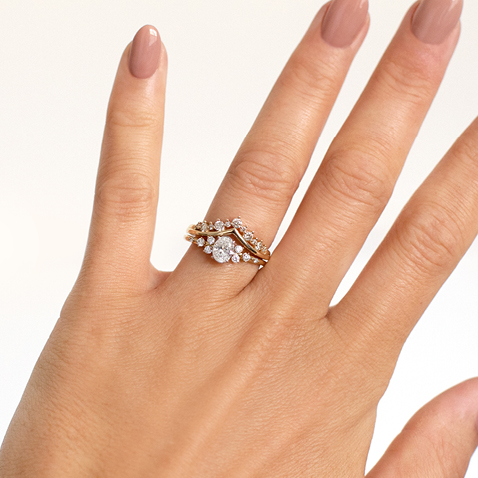 multistone cluster engagement ring with chevron diamond enhancer