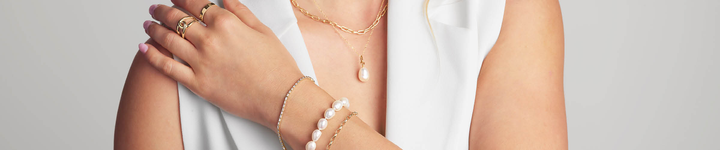 women wearing pearl jewellery styled with gold jewellery