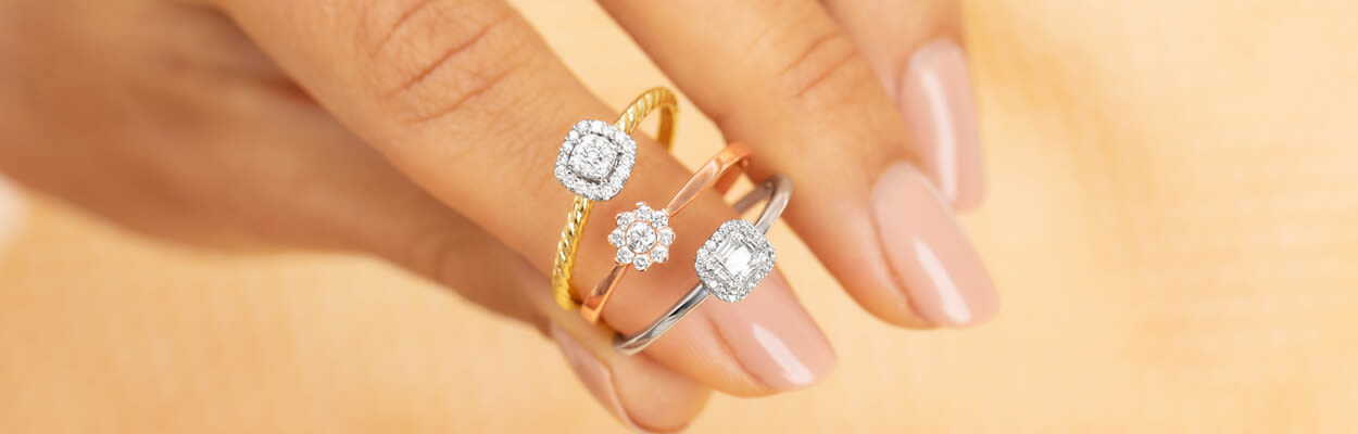 various promise rings held in hand