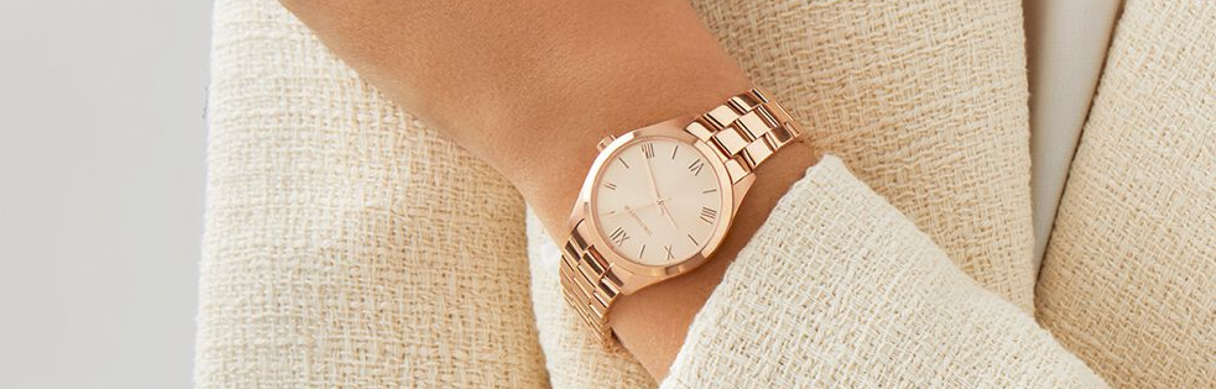woman wearing rose gold watch