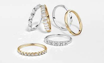 wedding bands flatlays yellow gold and white gold with diamonds
