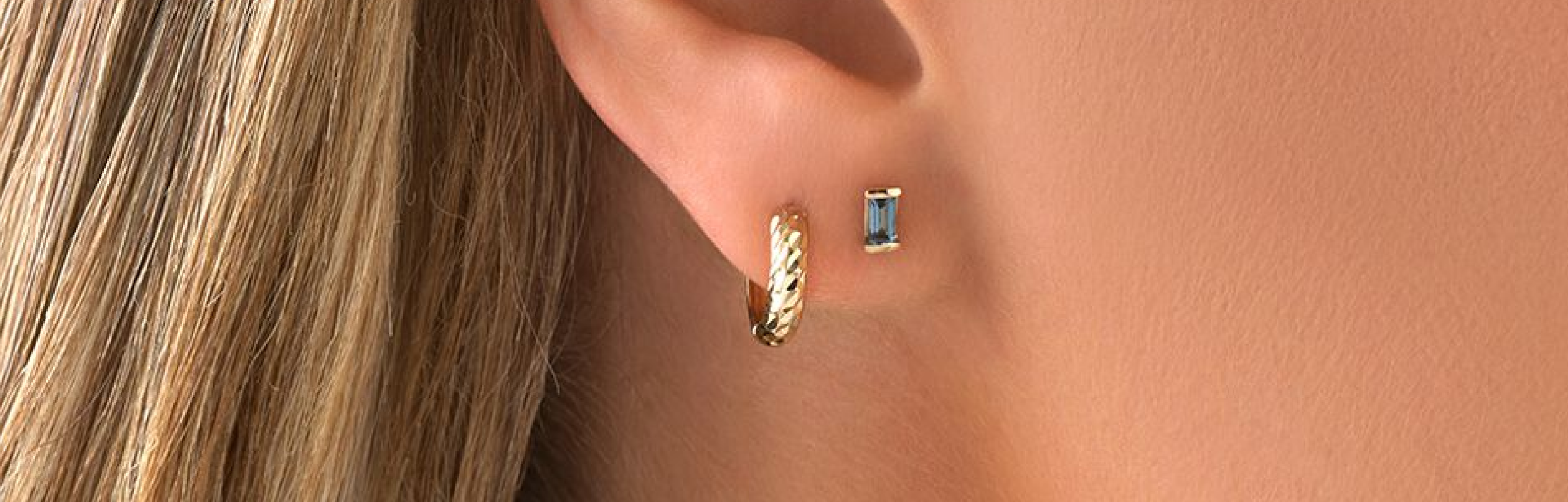 gold stud earring with blue sapphire stone