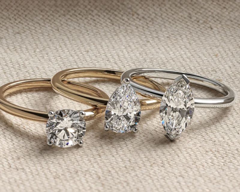 three different style engagement rings