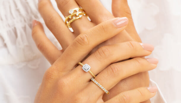 woman wearing different ring styles