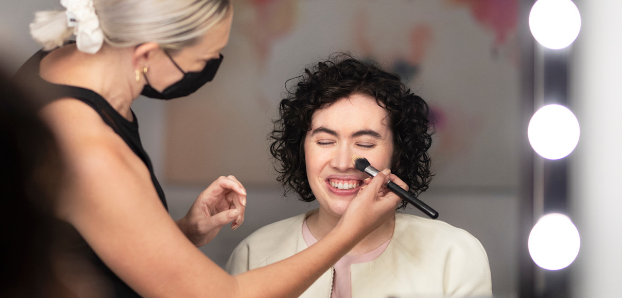 A Dress for Success client having her hair and makeup done