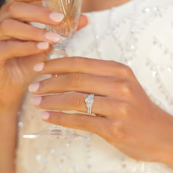 White gold diamond ring and wedding band on left hand ring finger