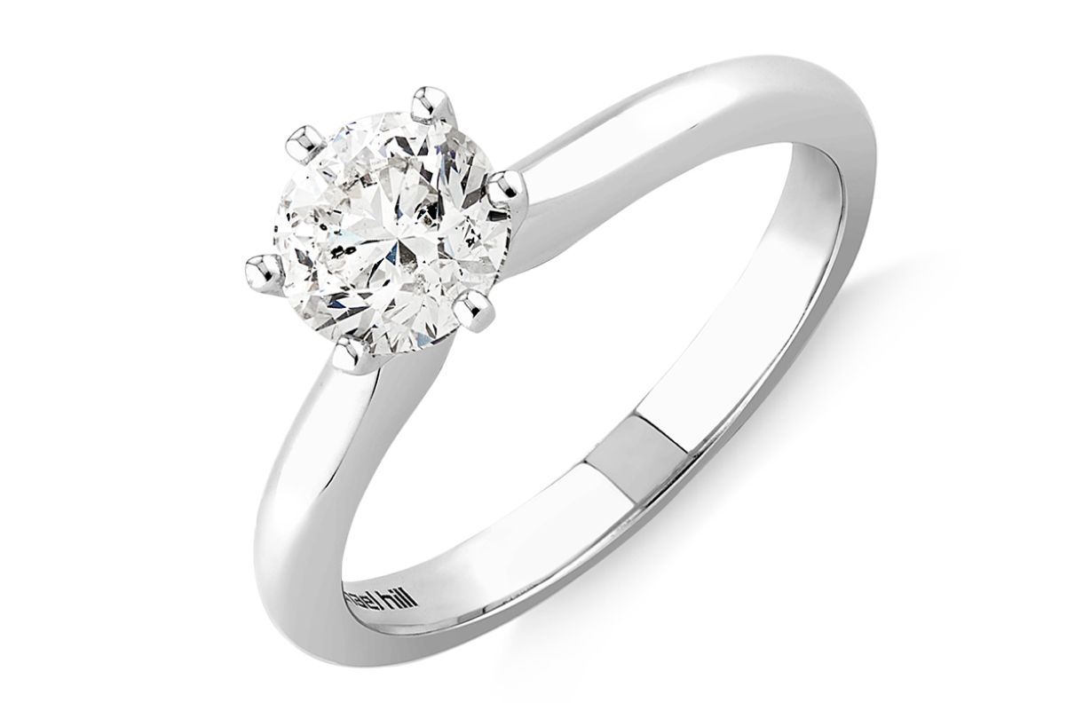white gold solitaire style engagement ring