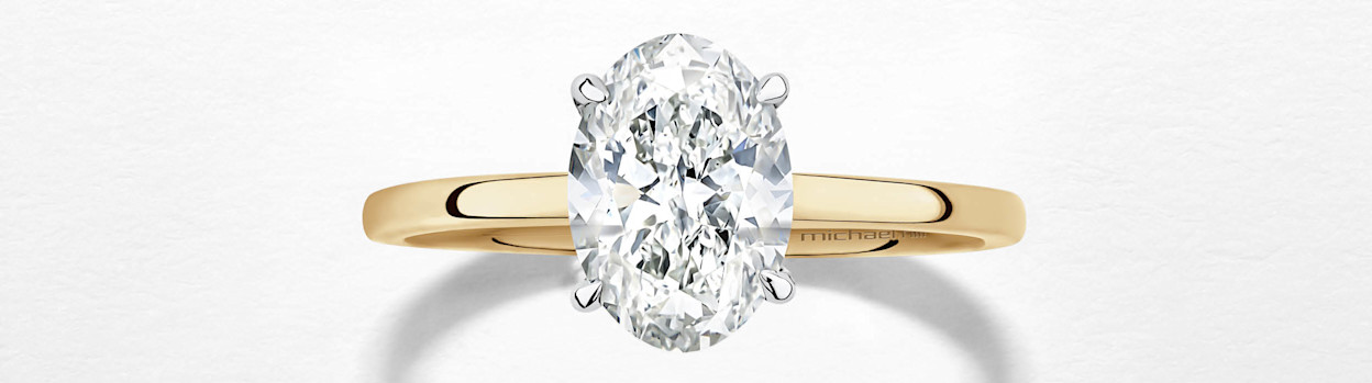 oval diamond ring in yellow gold