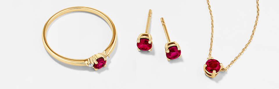 july birthstone ruby earrings necklace ring in yellow gold