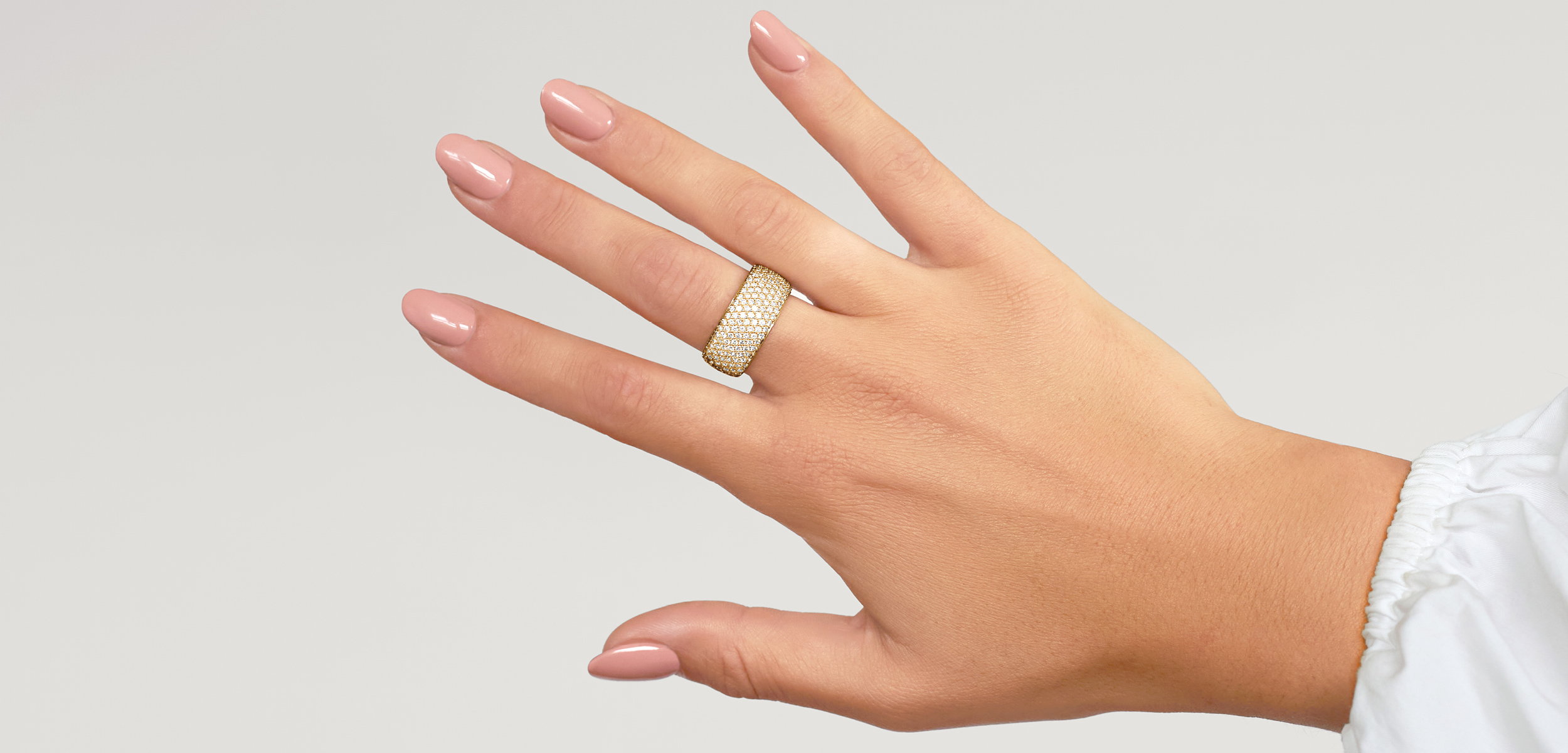 A statement diamond ring on a female hand