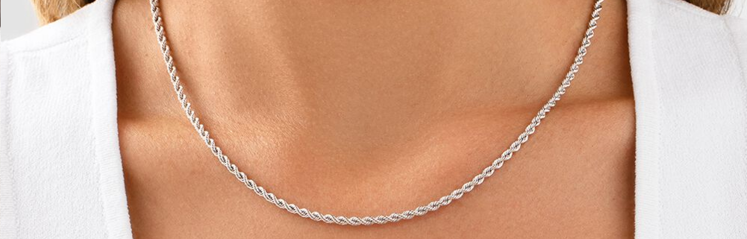 white gold rope chain on womans neck