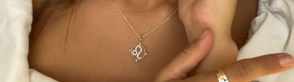 Woman wearing zodiac necklace
