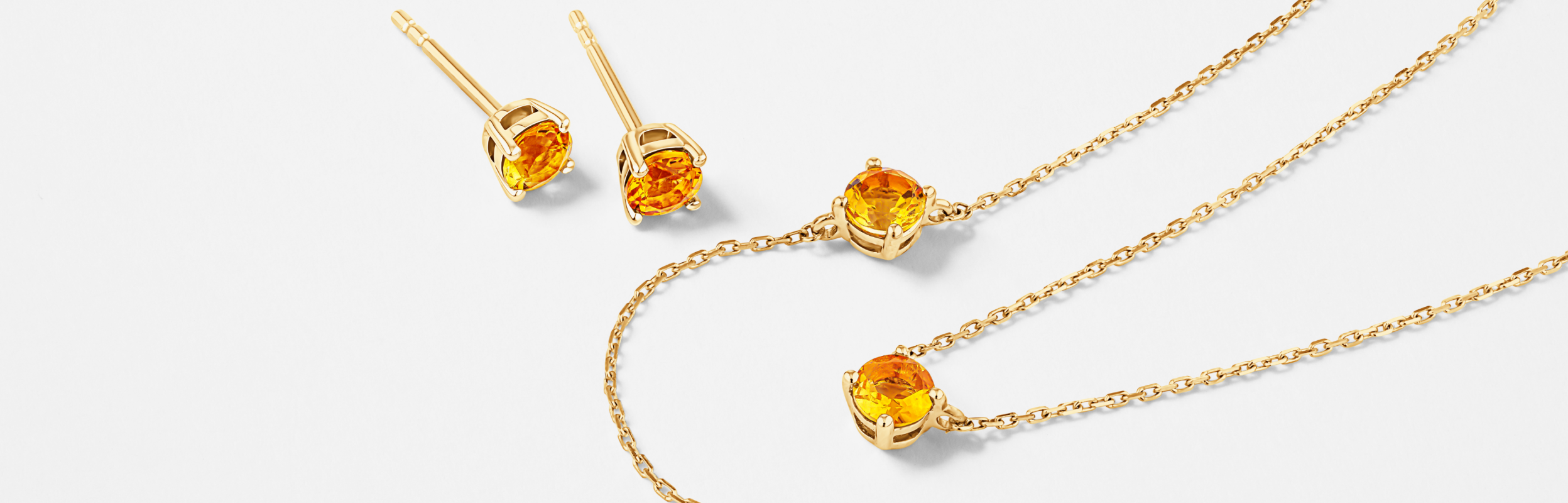 Citrine earrings, necklace and bracelet in yellow gold