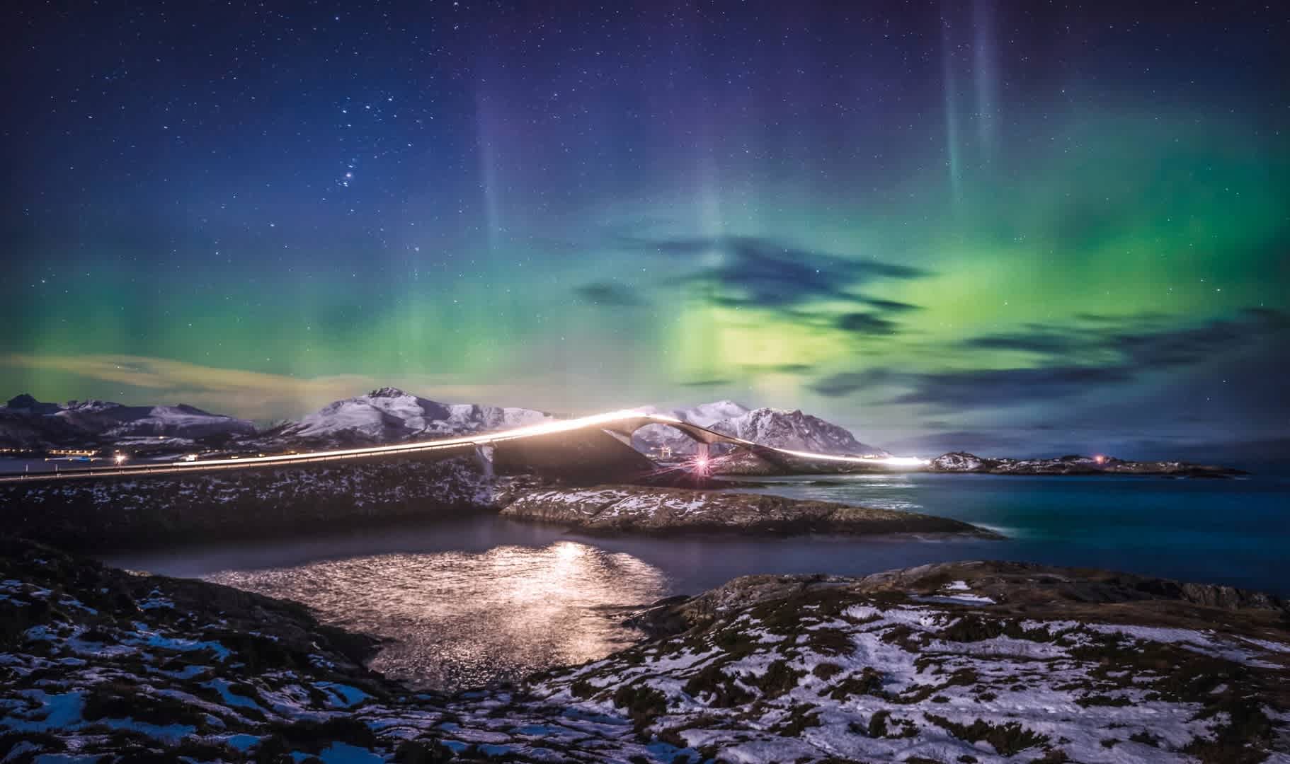 The Northern Lights over the Atlantic Ocean Road, dubbed by many as one of the world’s most beautiful road trips