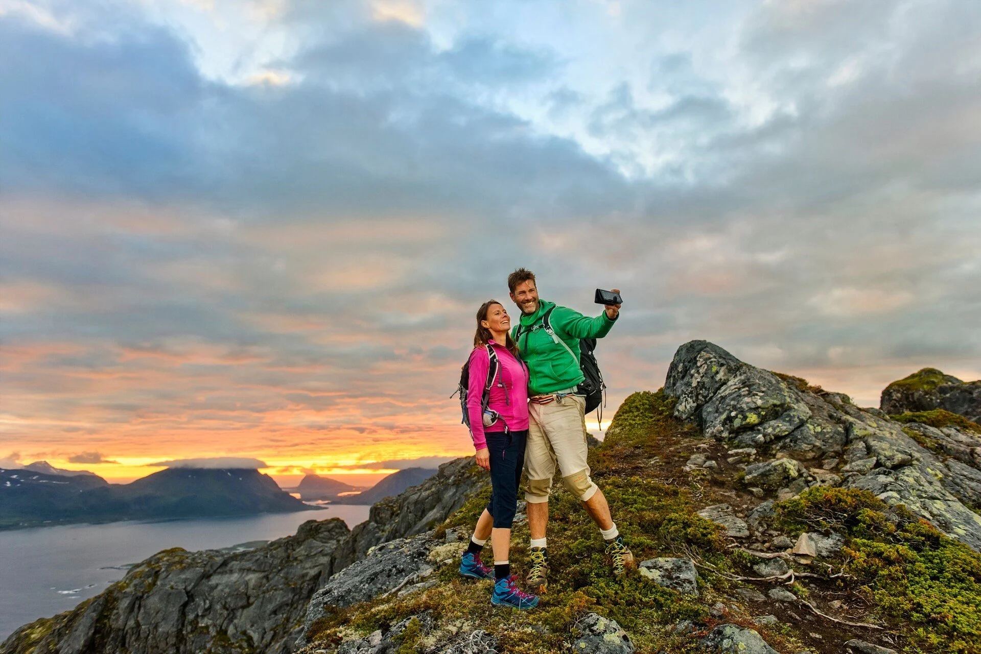 A couple hiking in the Lofoten Islands in Norway