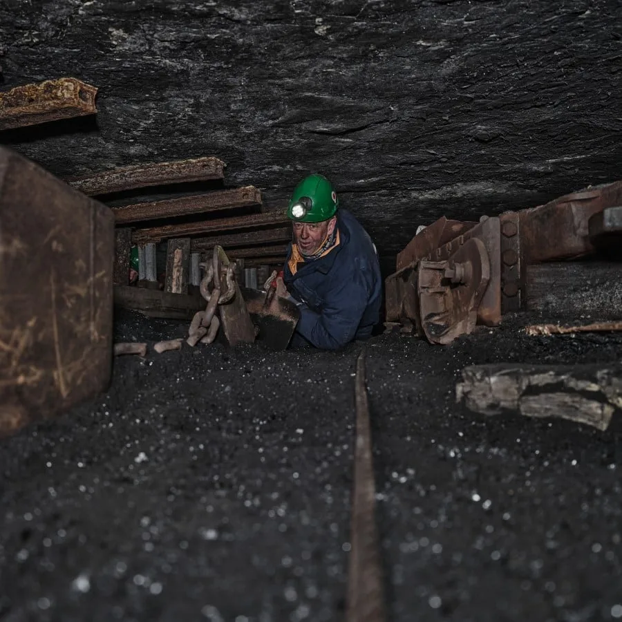 A man exploring the Gruve 3 Mine on a local tour in Longyearbyen