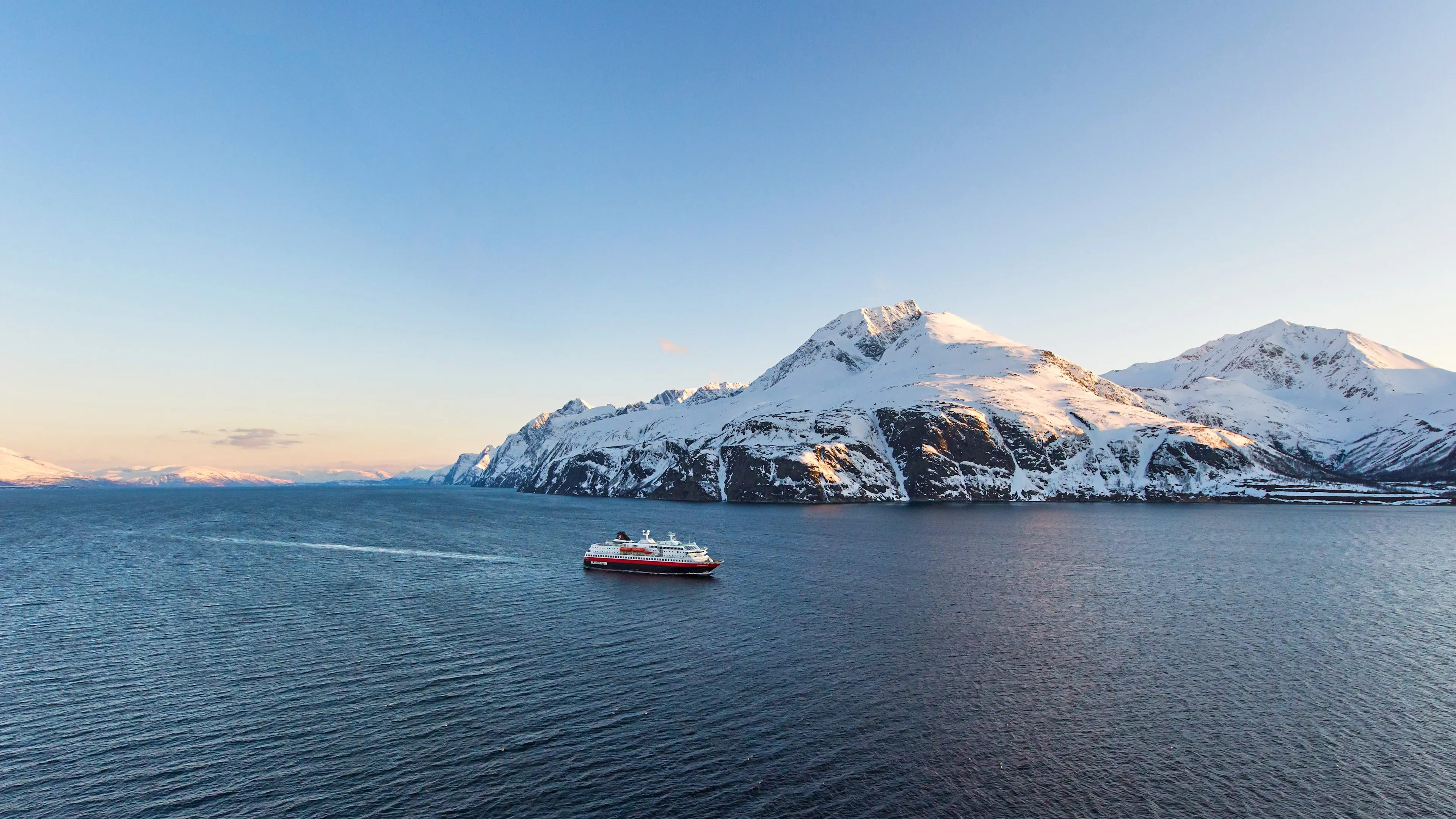 Ship sailing the Norwegian coast in winter