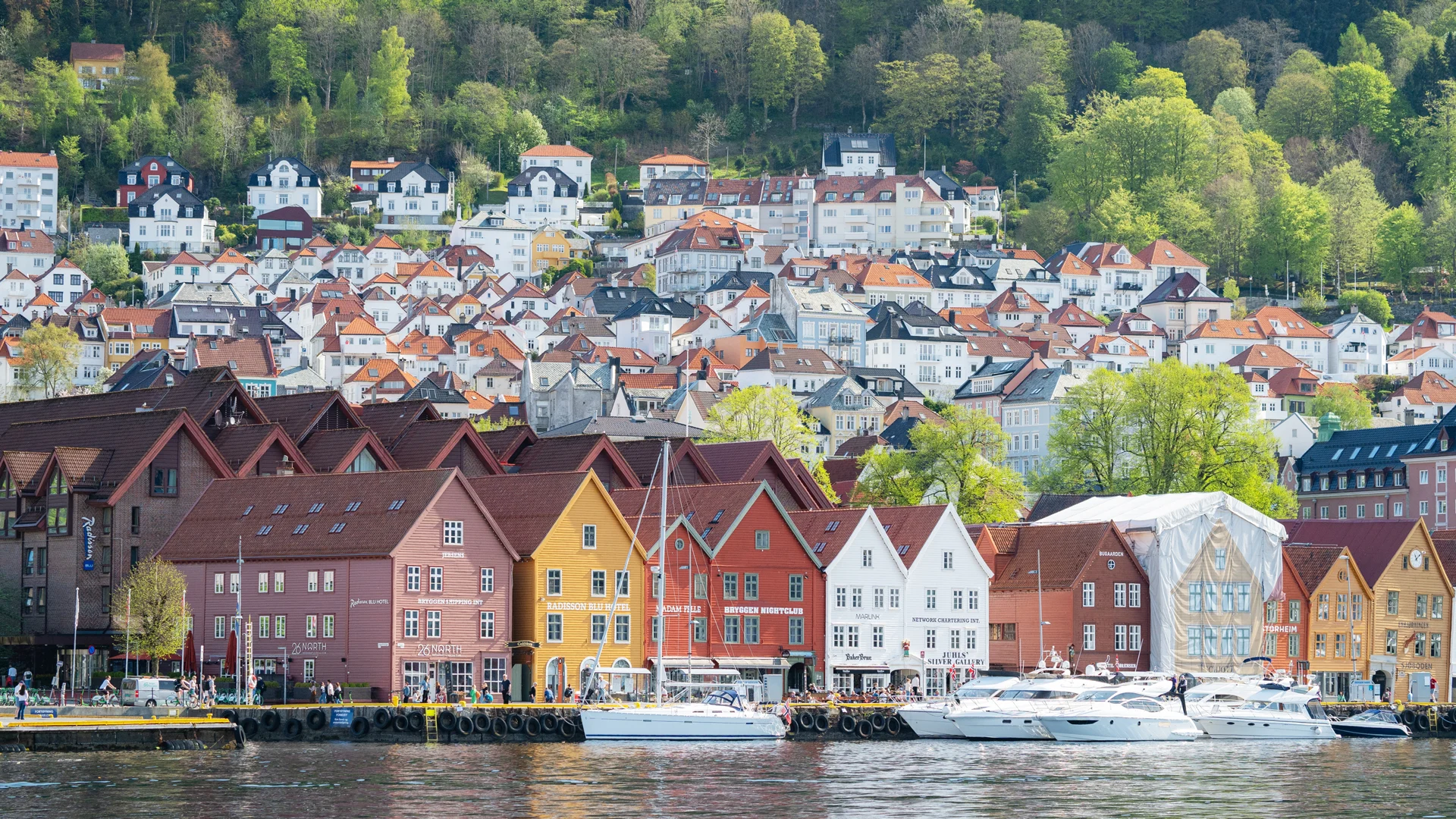 Stroll past shops, art galleries and cosy cafés in Bergen’s UNESCO-listed Bryggen quarter