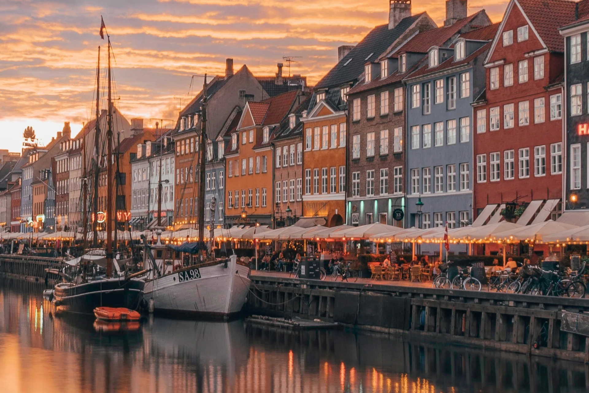 Take an evening stroll along the canals of Copenhagen, and visit one of the many local cafés