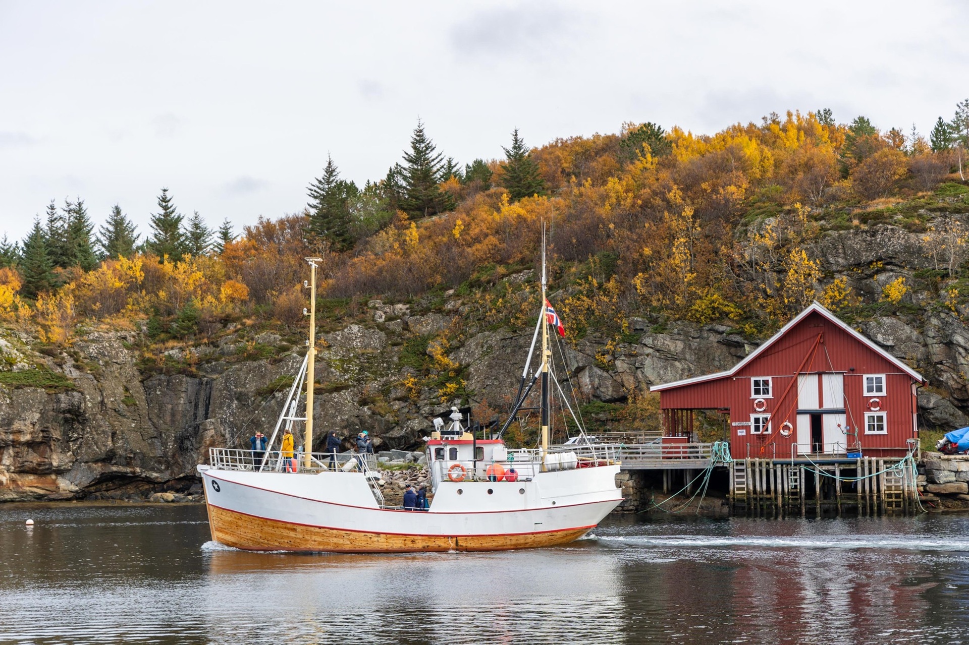 traditional-fishing-boat-autumn-red-boathouse